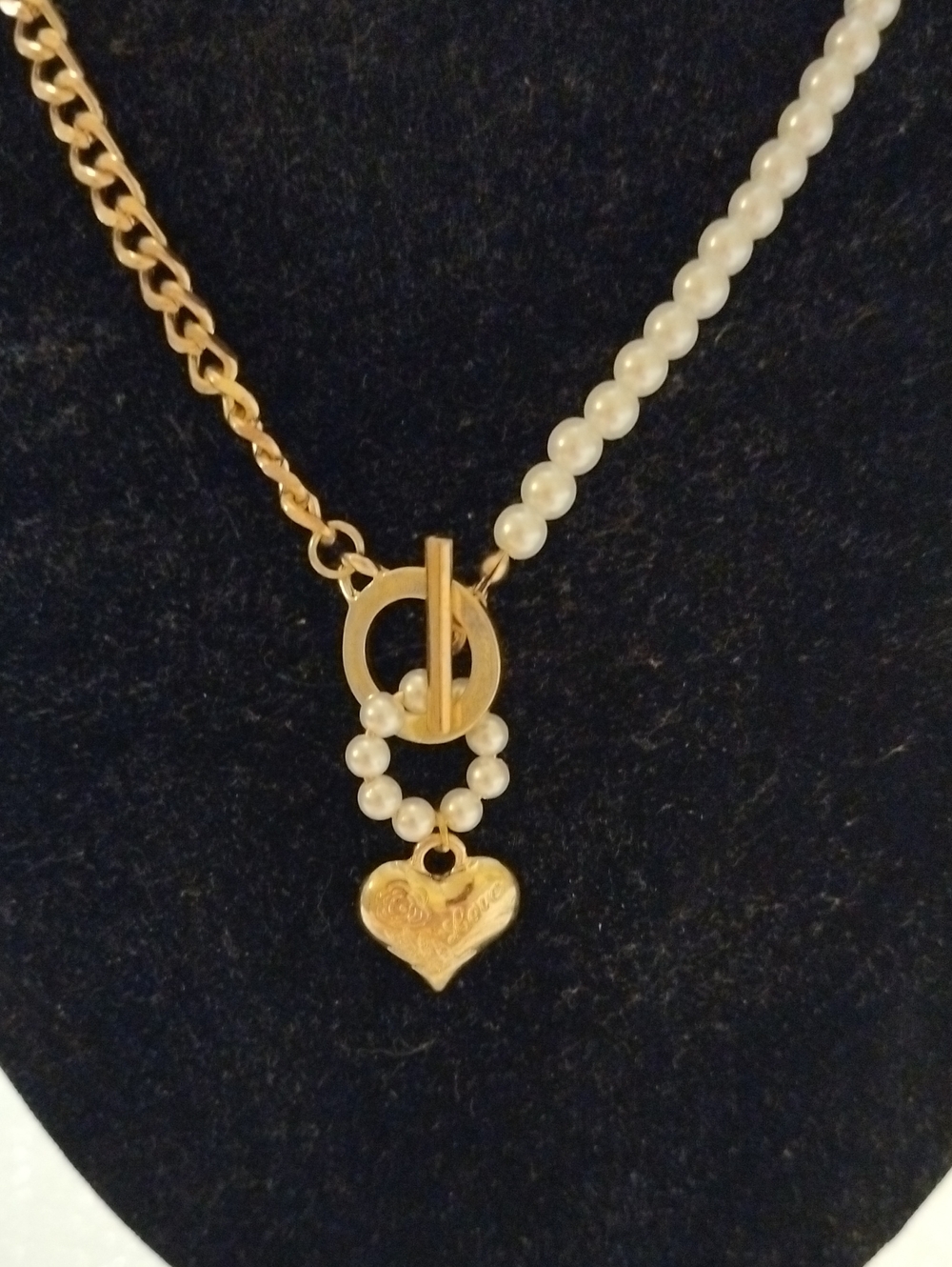 Gold-plated Cuban chain spliced with pearls and a heart charm.